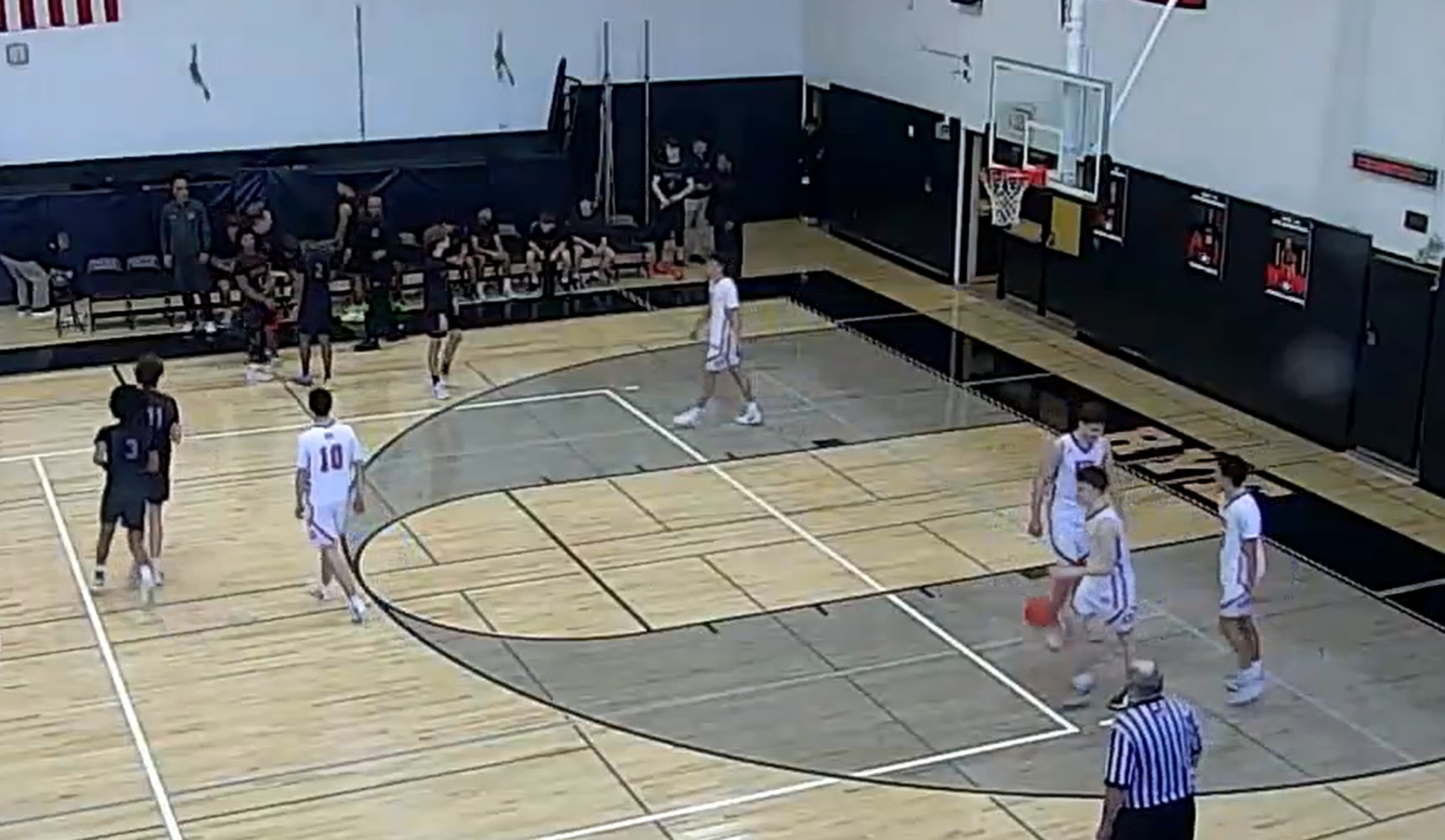 (PHOTO: The Rye Boys Basketball team in the waning seconds of a playoff victory over Nyack on February 21, 2026.)