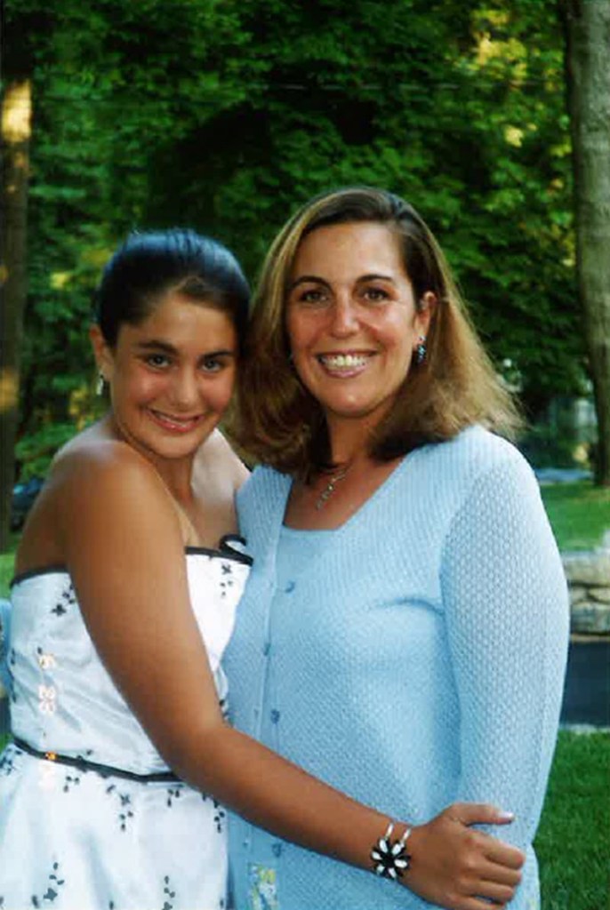 (PHOTO: Sandy Chittenden and her daughter Jillian at her Osborn Elementary School moving up ceremony. Contributed.)