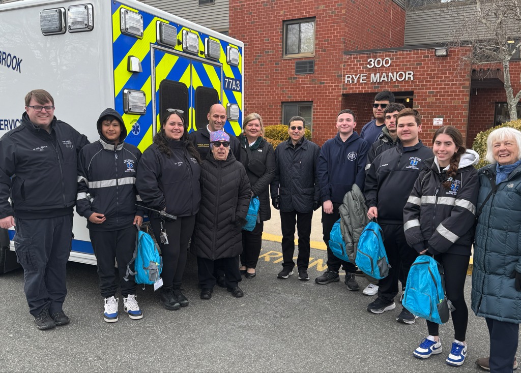 (PHOTO: In conjunction with Port Chester-Rye Rye Brook EMS, the Rye Senior Advocacy Committee distributed emergency preparedness kits for homebound seniors at Rye Manor on Theall Road. Contributed.)