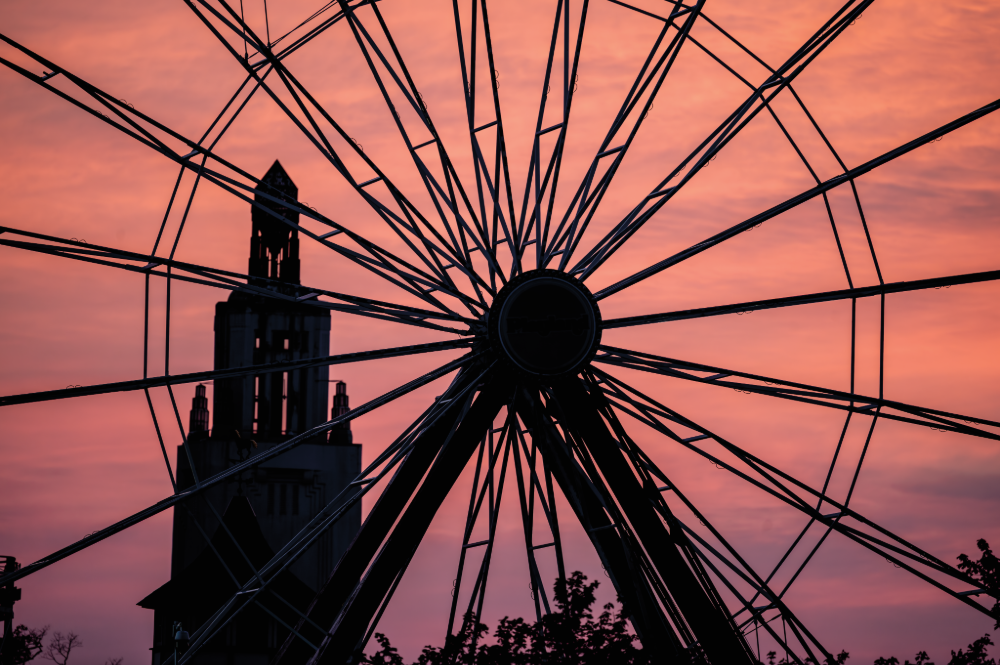 (PHOTO: The Ferris Wheel. Playland's ferris wheel framing the sunset. By Stacey Massey, author of First Light, Rye.)