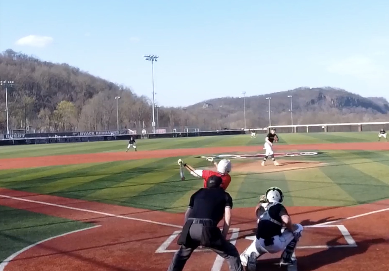 (PHOTO: Rye Baseball's Nolan Hutson hitting a triple vs Nyack on April 13, 2026. Credit: GameChanger.)