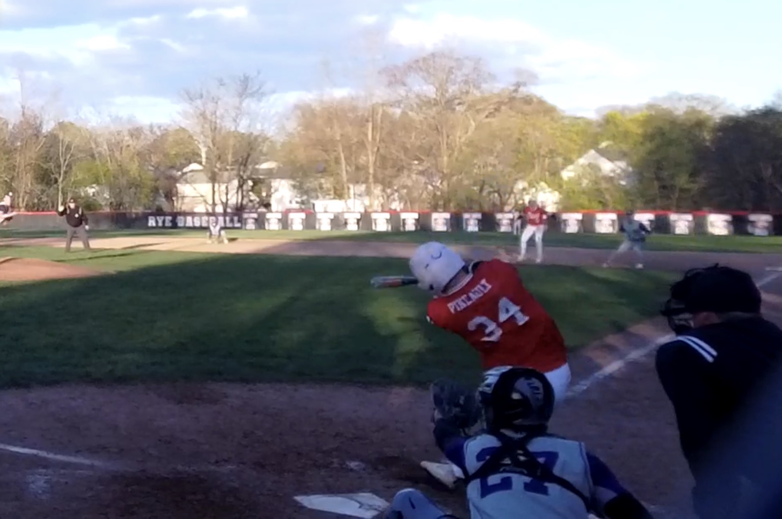 (PHOTO: Rye Baseball's Jackson Pineault (#34) hitting a walk-off home run on April 20, 2026. Credit: GameChanger.)