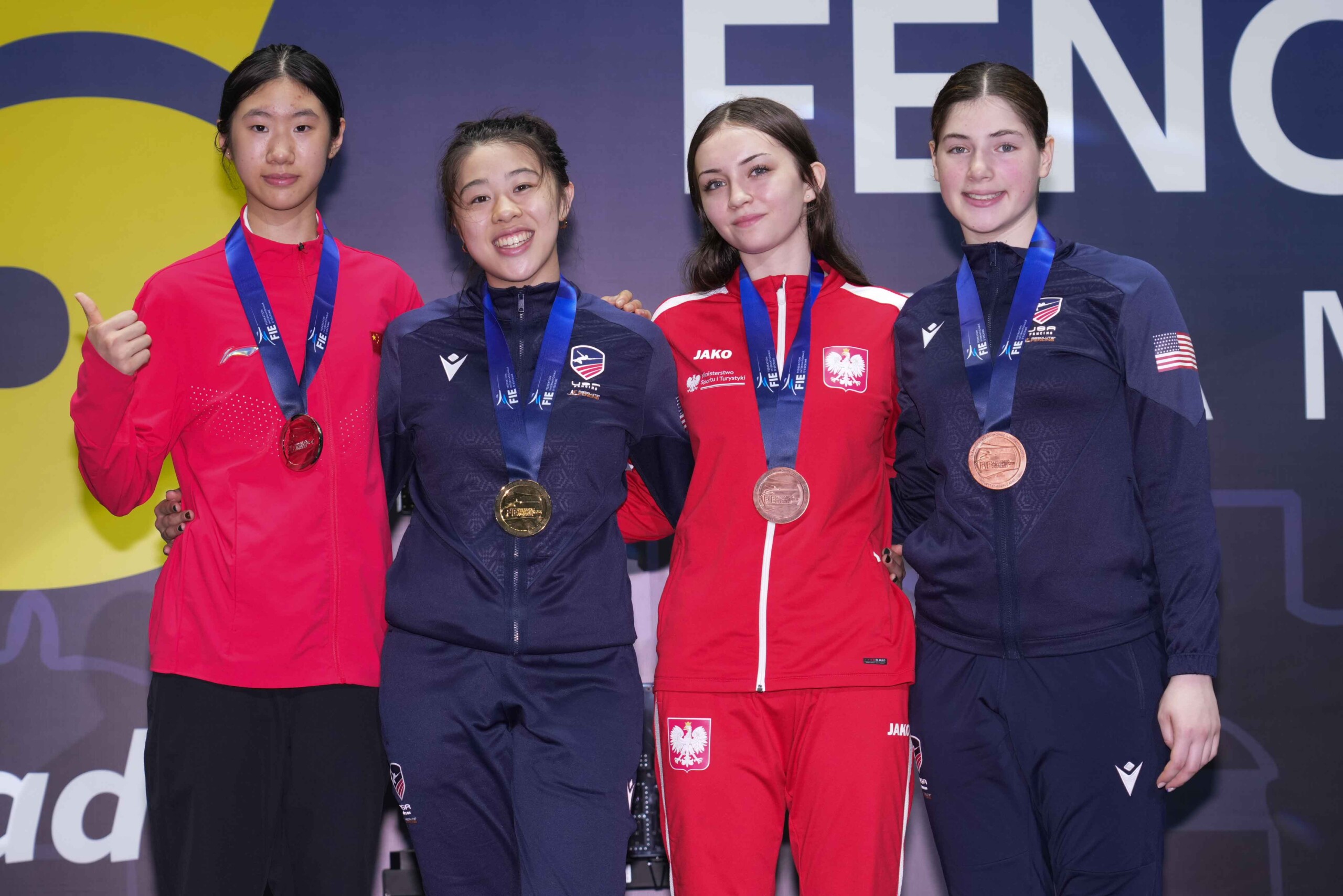 The podium for the 2026 Rio Cadet Women's Individual Foil event at the FIE World Championships. L to R: silver medalist Yixin Zhang, gold medalist Jaelyn Liu, bronze medalist Danuta Tym, and bronze medalist from Rye, NY Ella Calise. Contributed.)