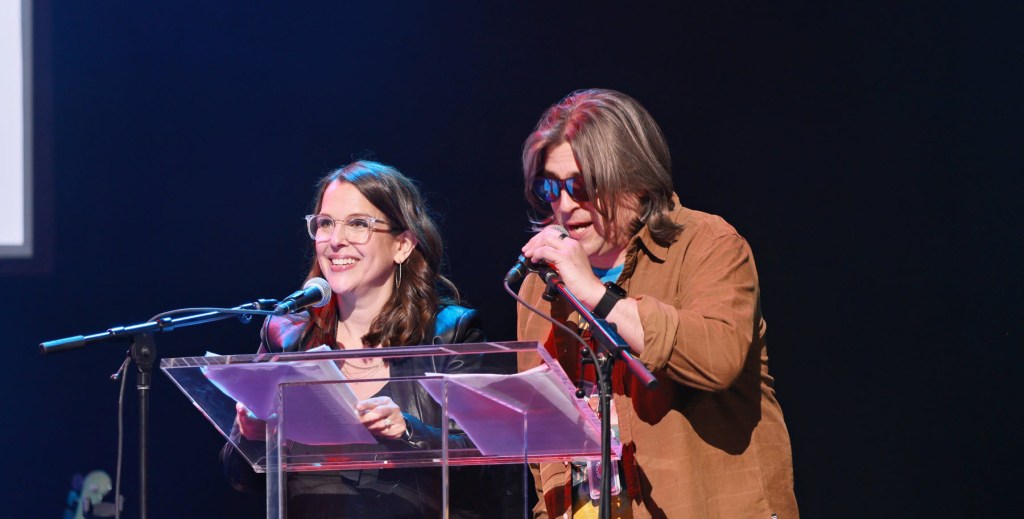 two people at a podium