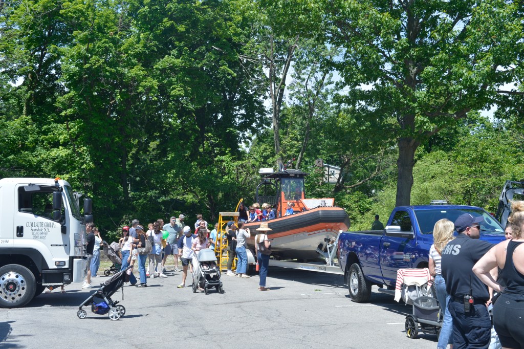 (PHOTO: Vehicles of all sorts were on display at the Library's Vehicle Fair, including trucks, cars, and even a boat. Credit: Claire Hovers.)
