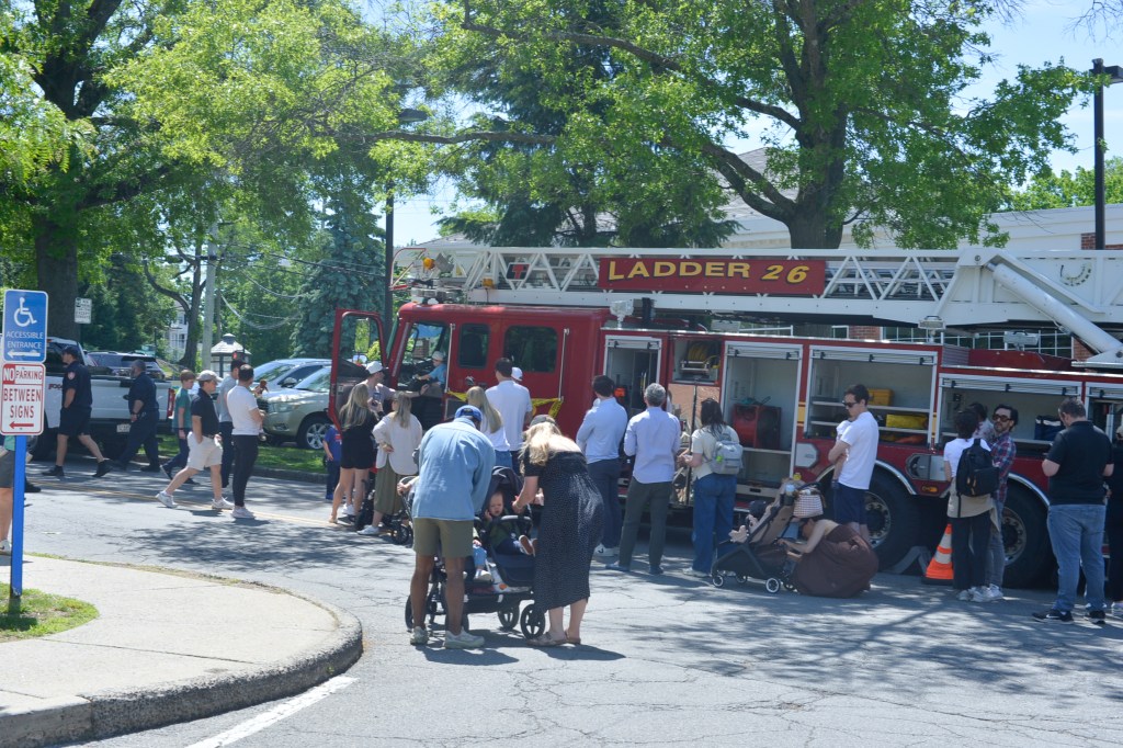 (PHOTO: A Rye Fire Department firetruck opened its many doors to attendees of the Vehicle Fair. Credit: Claire Hovers.)