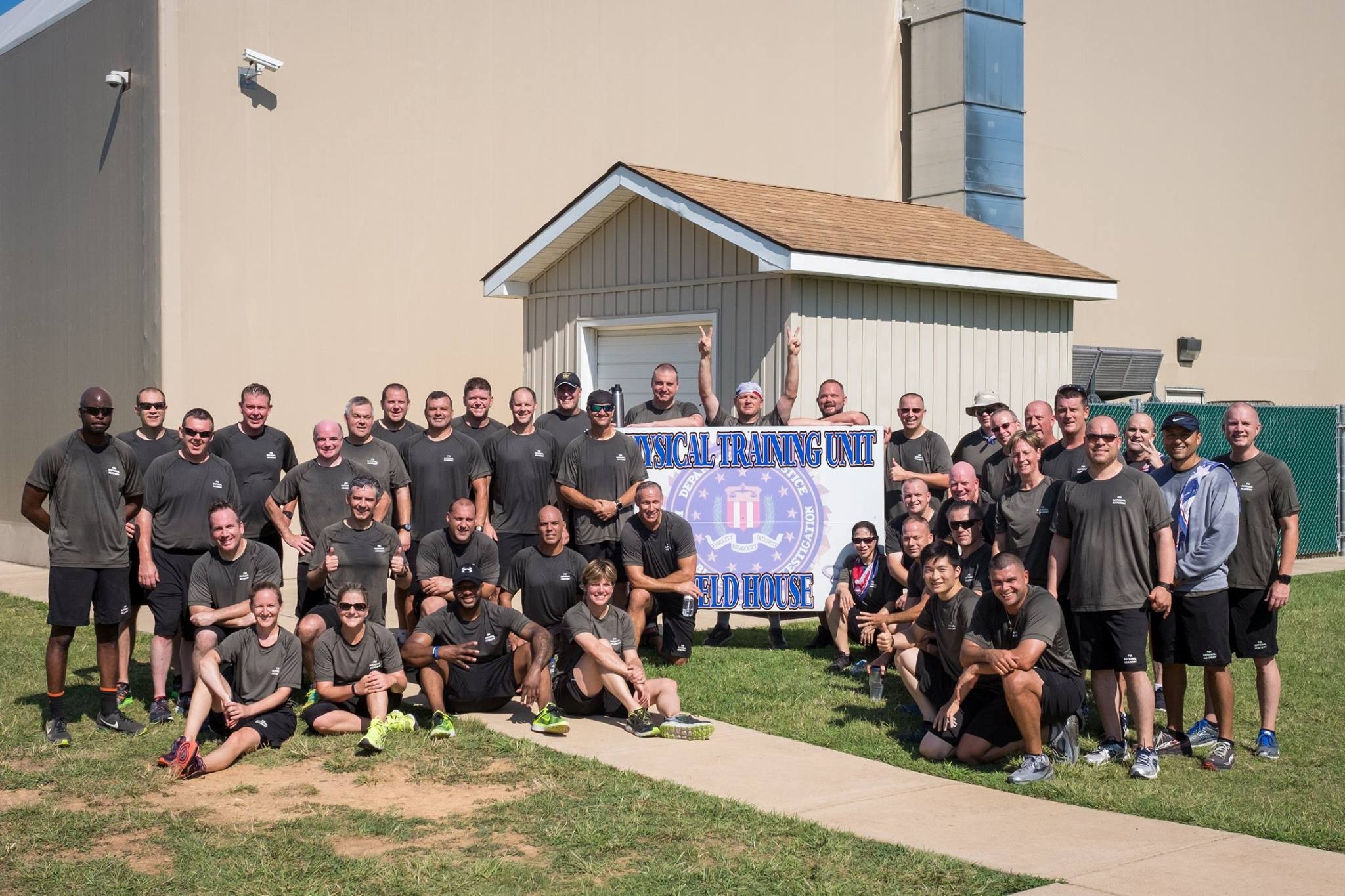 (PHOTO: Detective Lieutenant Michael Anfuso presenting as part of his behavioral analysis class at the FBI Academy. Anfuso is kneeling in the second row at the far left. Contributed.)