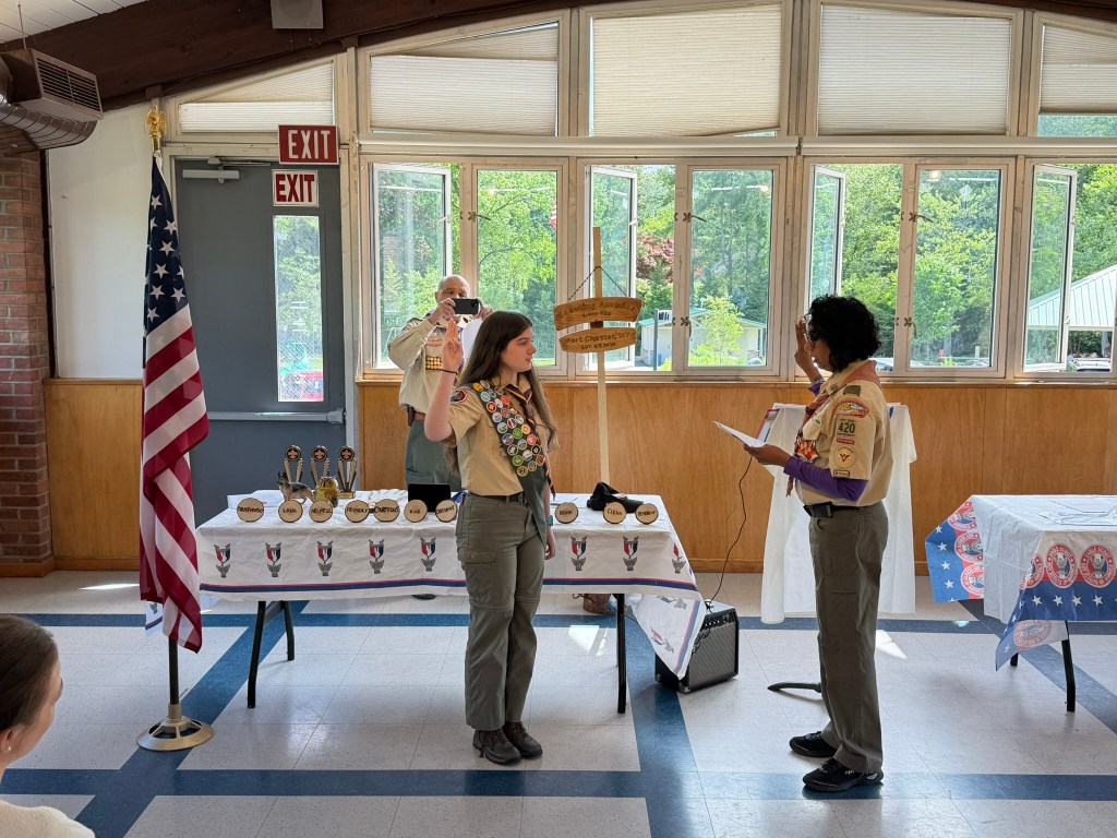 One person administering an oath to the second person.
