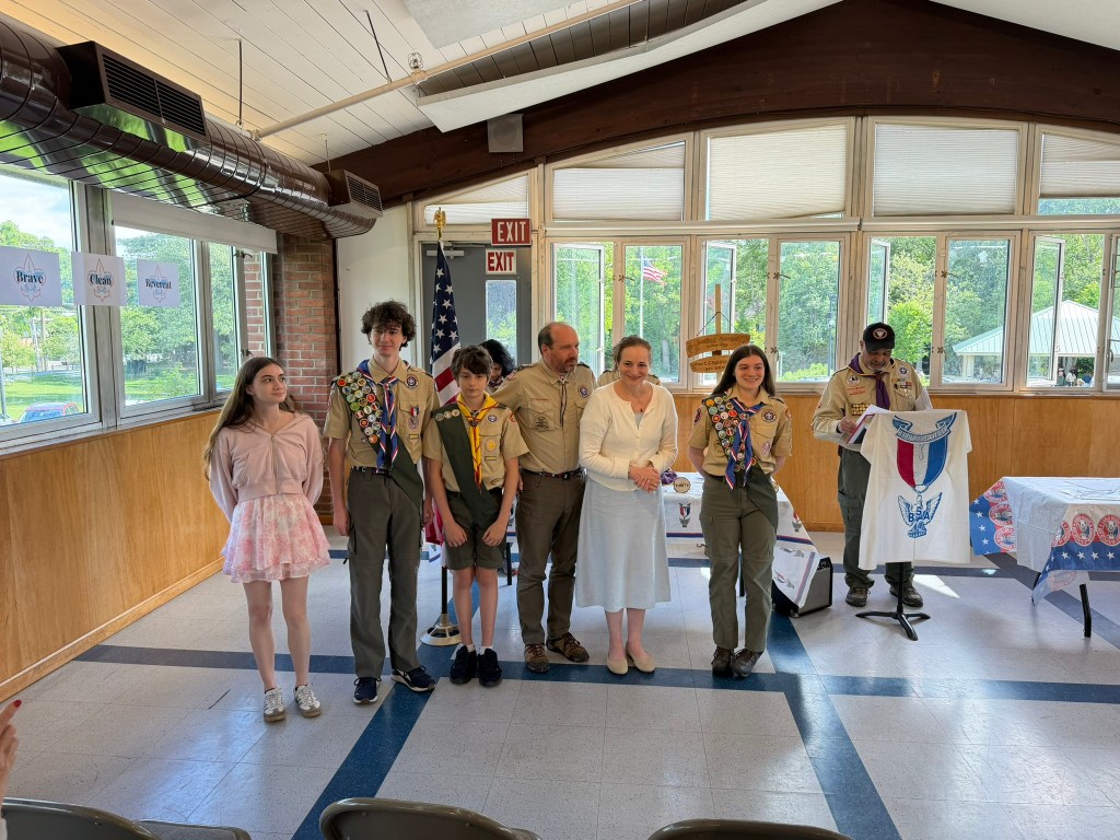 Family posing for photo at an event