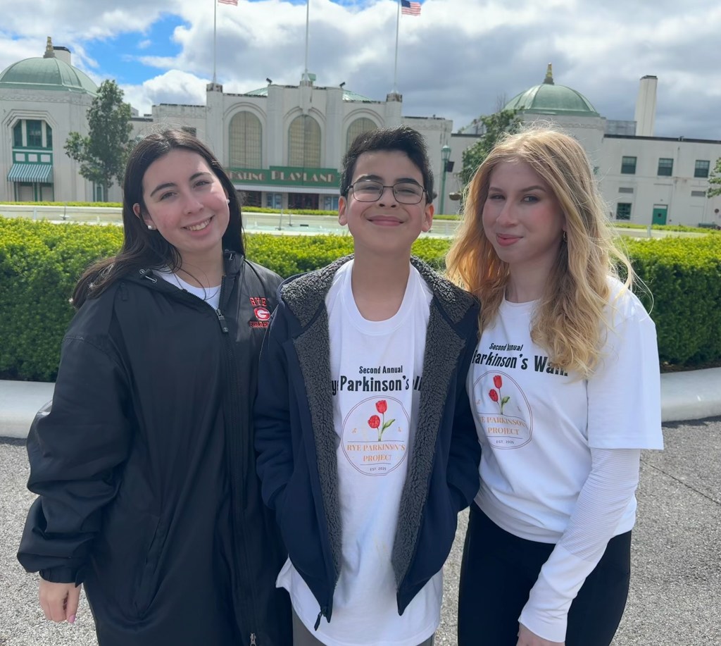 (PHOTO: Co-founders and siblings of the Rye Parkinson's Project, Gabriela and Sofia Steinmetz, with younger brother Noah Steinmetz at the second annual Rye Parkinson's Walk. Contributed.)