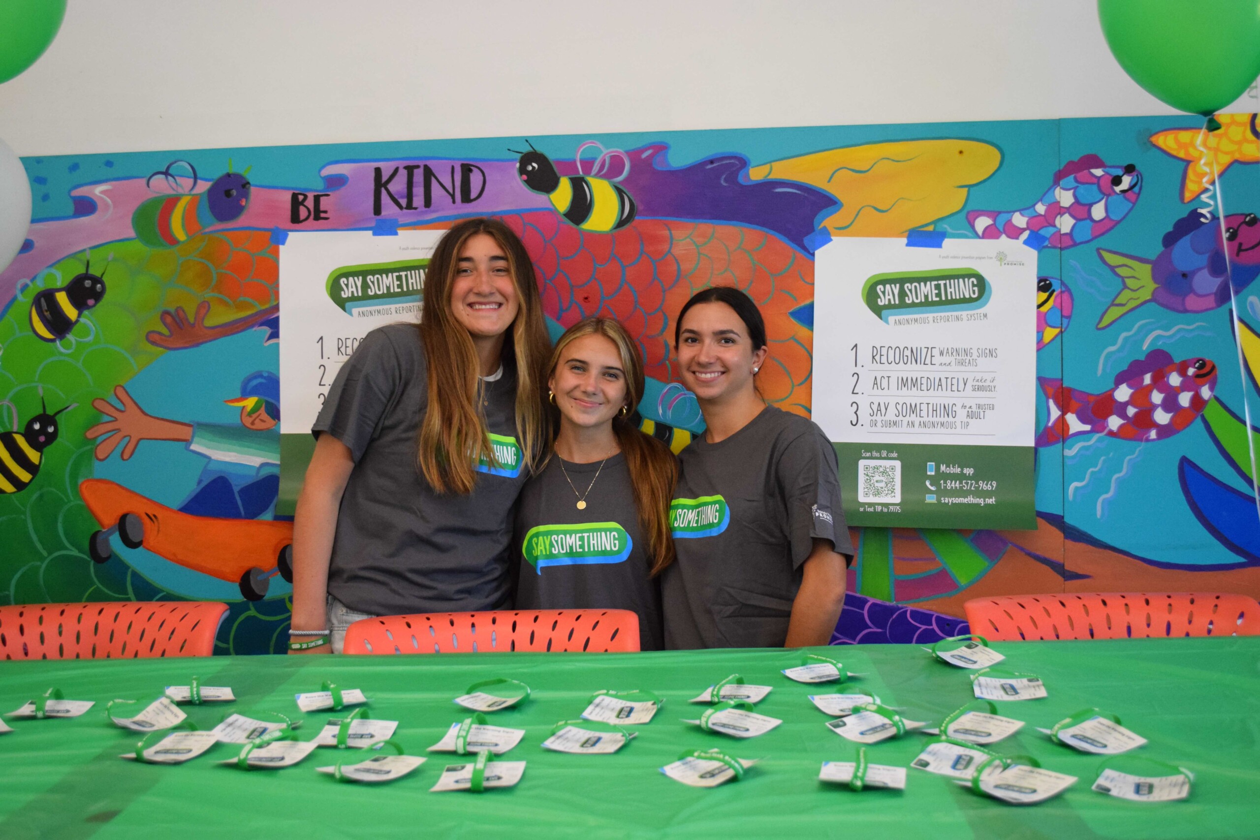 students at an information table