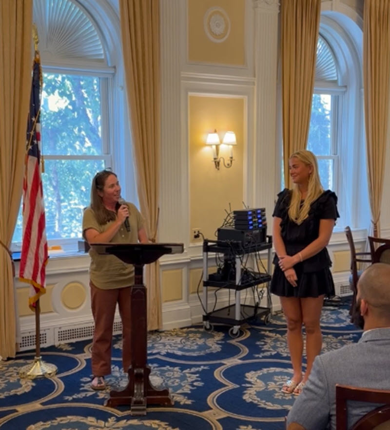 two people at podium
