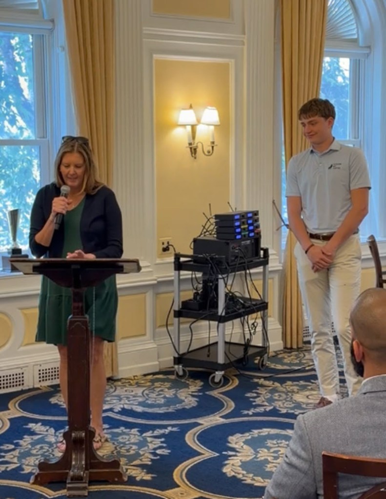 two people at podium