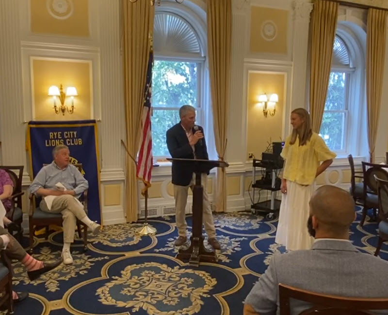 two people at podium