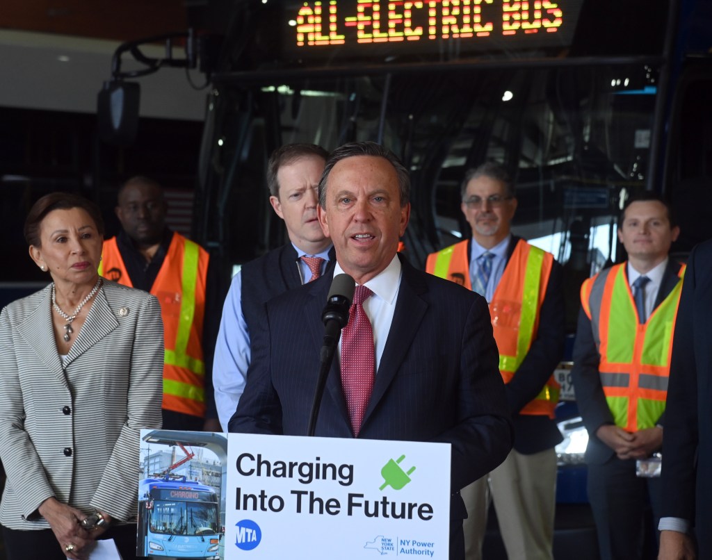 (PHOTO: NYPA President & CEO Justin Driscoll announces an additional 60 all-electric buses joining the MTA fleet at the Grand Avenue Depot on Tuesday, May 14, 2024. Public Domain.)