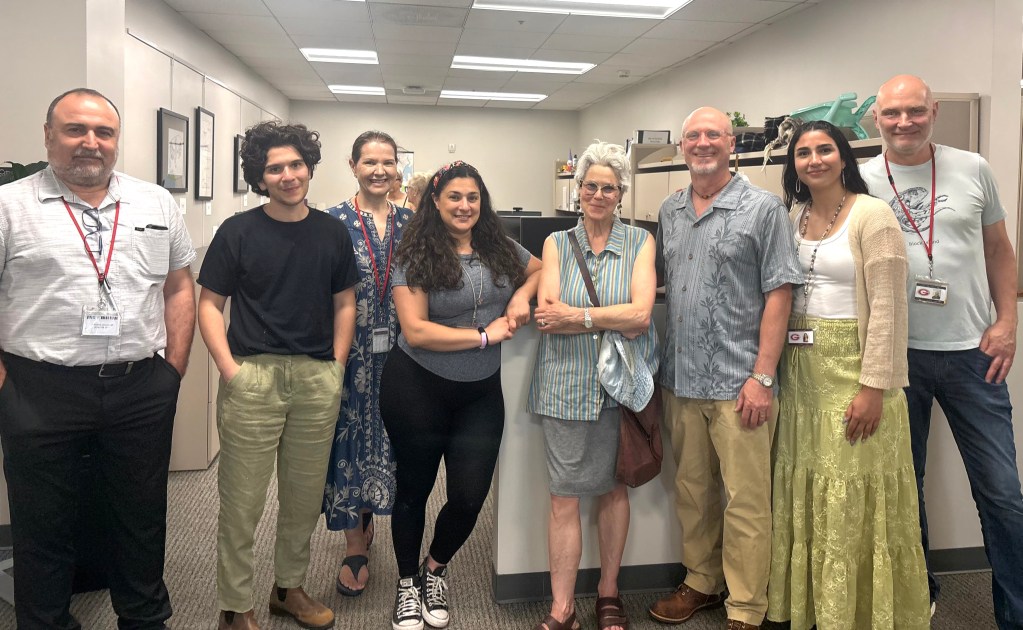 (PHOTO: Rye City School District's art teachers (left to right) Bendis Mani, ? , Kim Tamalonis, Carla Ricchiuti, Anthony Campbell, ? ,and ? gathered at the Central Admisitration Building to support their students whose art featured in the annual exhibit. Credit: Claire Curran.)