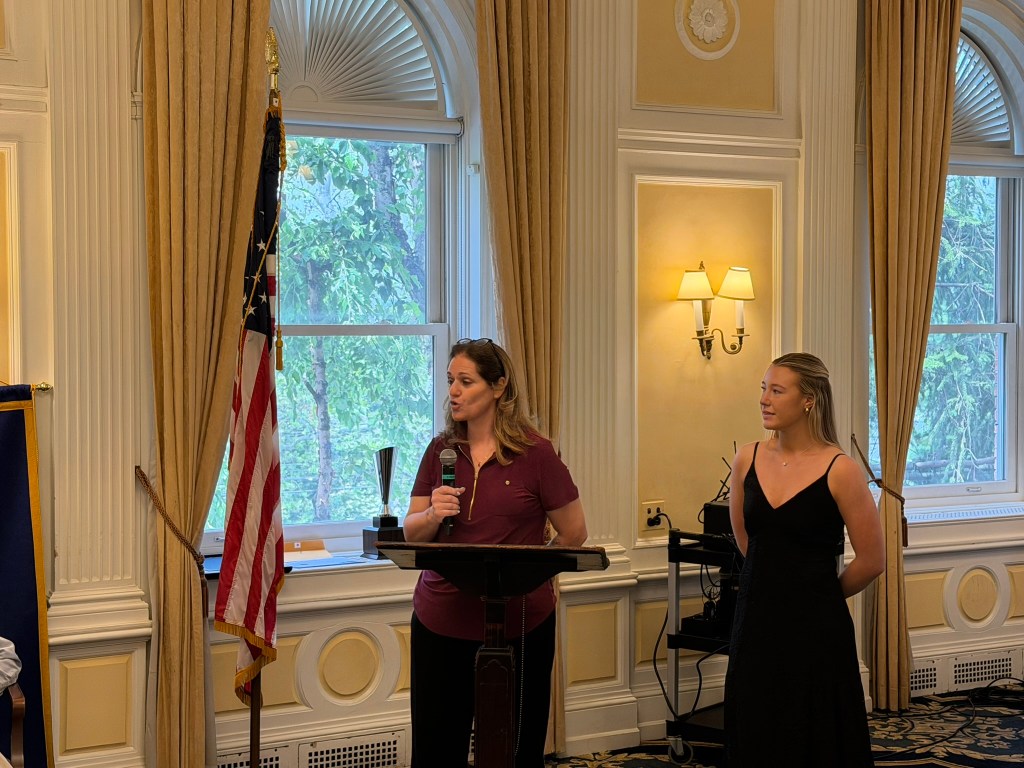 two people at podium