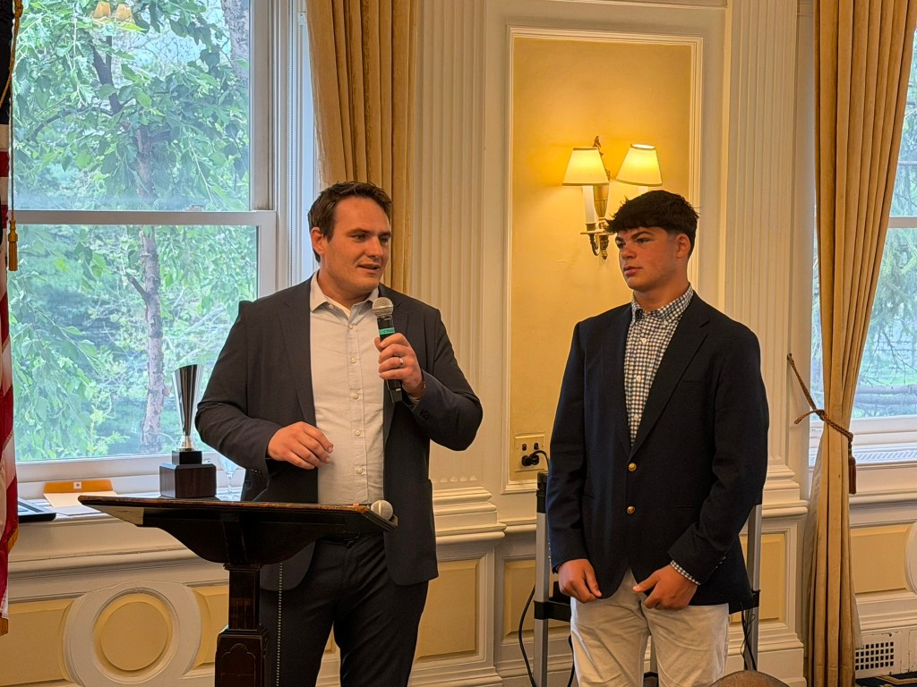 two people at podium