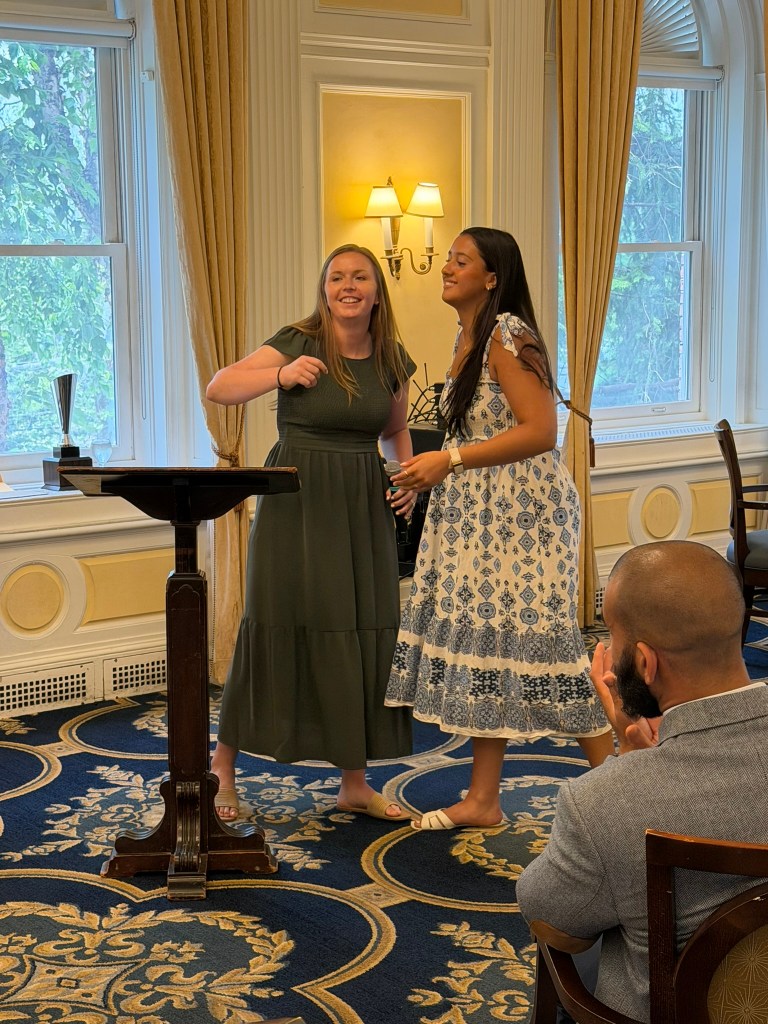 two people at podium