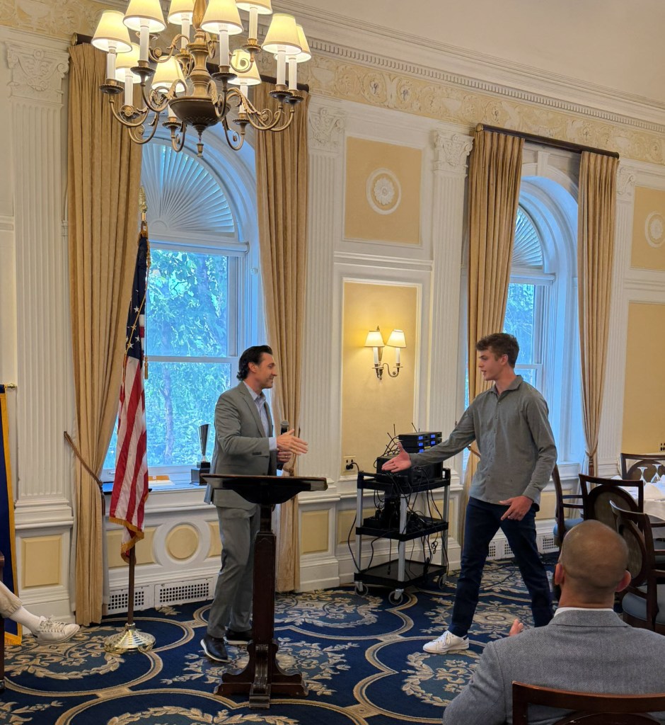 two people at podium