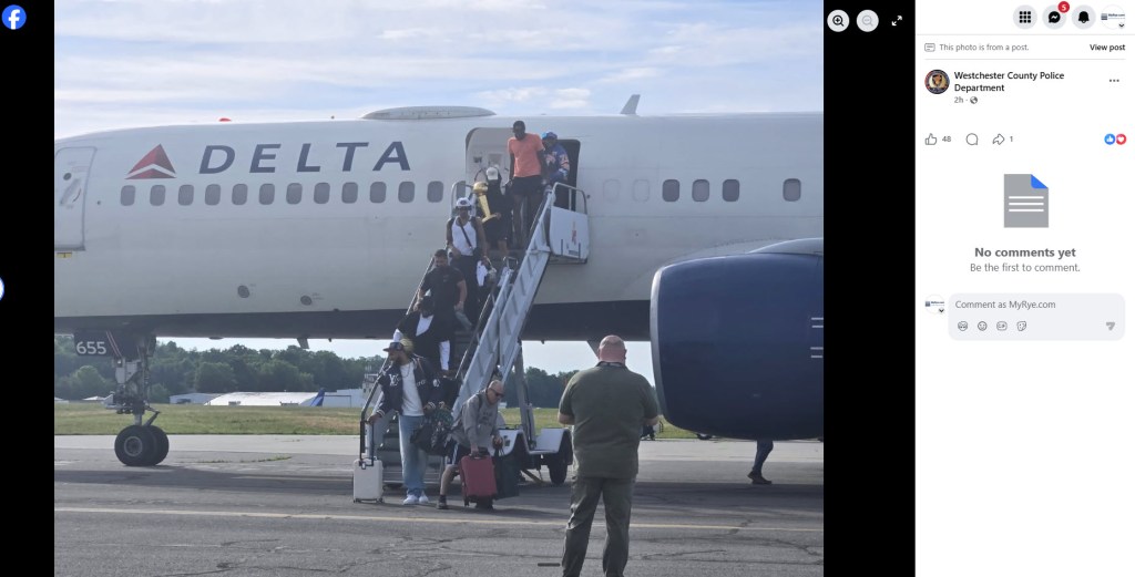 passengers disembarking airplane.
