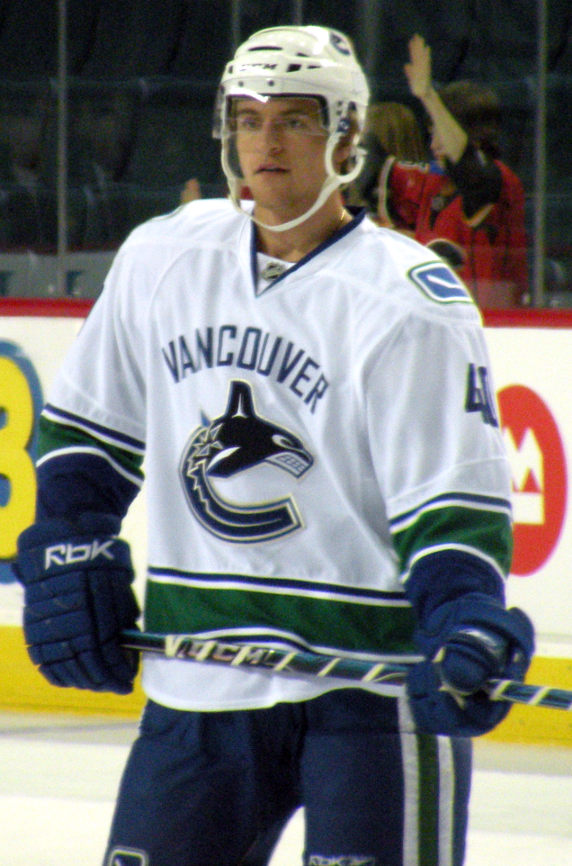 (PHOTO: Vancouver Canucks forward Michael Grabner prior to a National Hockey League game against the Calgary Flames in Calgary. 16 October 2009. Public Domain: Wikimedia Commons.)