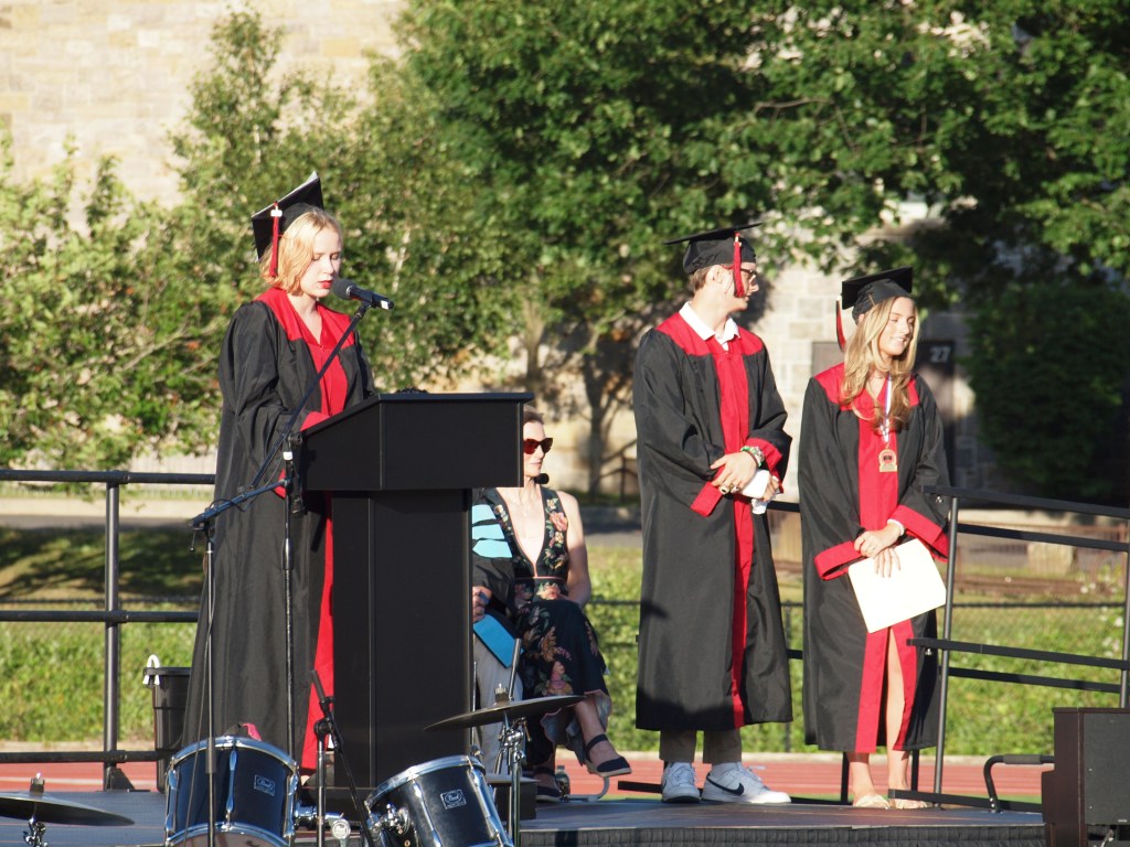 (PHOTO: The Latin Oration at Rye High School's 95th graduation ceremony was given by graduating seniors Carson Miller, Greta Murdock, and Sloane Paul.)