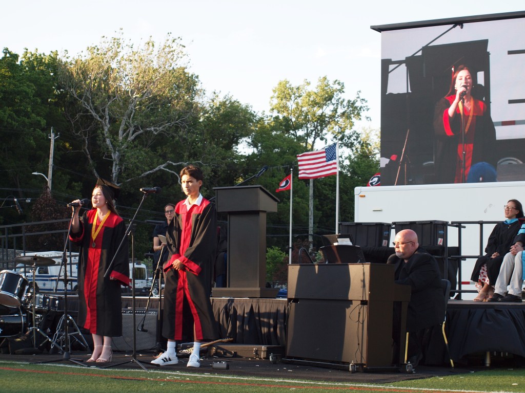 (PHOTO: Fiona Green and Lucas Gordon performed at the 95th Rye High School graduation, singing a duet of "That's Life" by Frank Sinatra.)