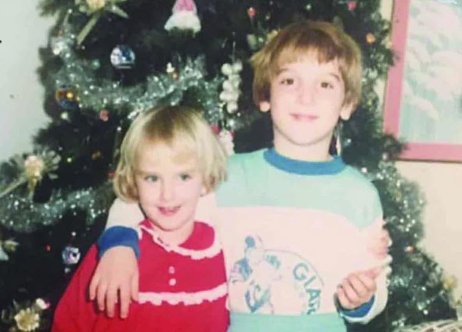 Photo of two children, a sister and brother.