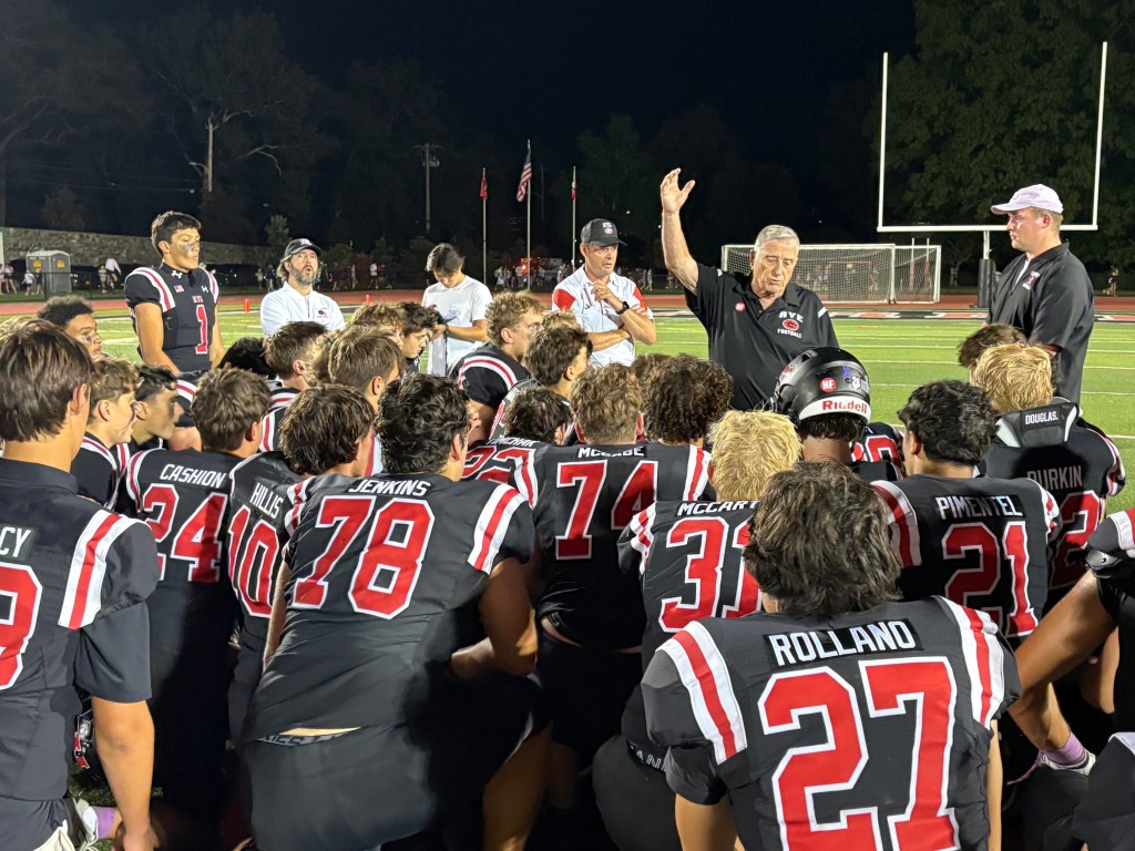 (PHOTO: The Rye Football team in a victorious huddle after a win on September 18, 2026. Contributed.)
