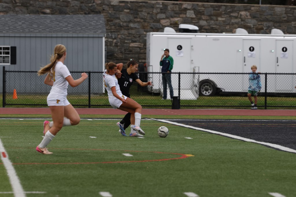 (PHOTO: Ry Girls Soccer's Shira Rand (#11) battling against Pelham on September 22, 2026. Credit: Alvar Lee.)
