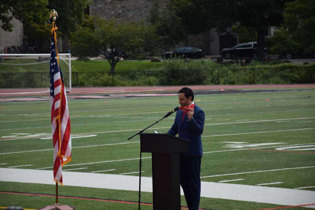 Principal speaking to students