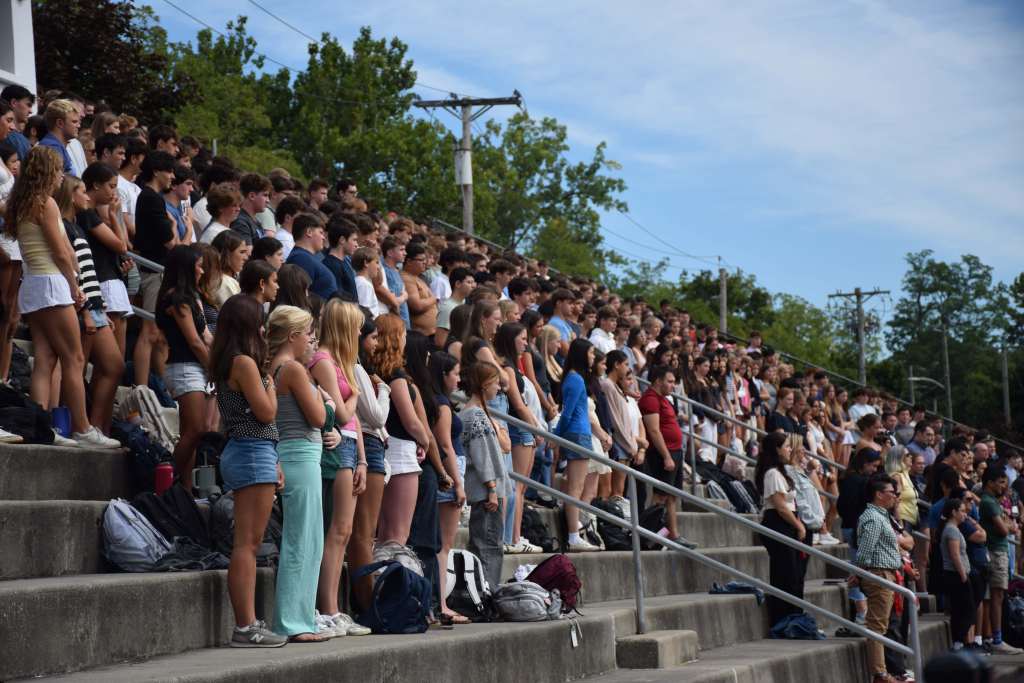 Students standing in stadium