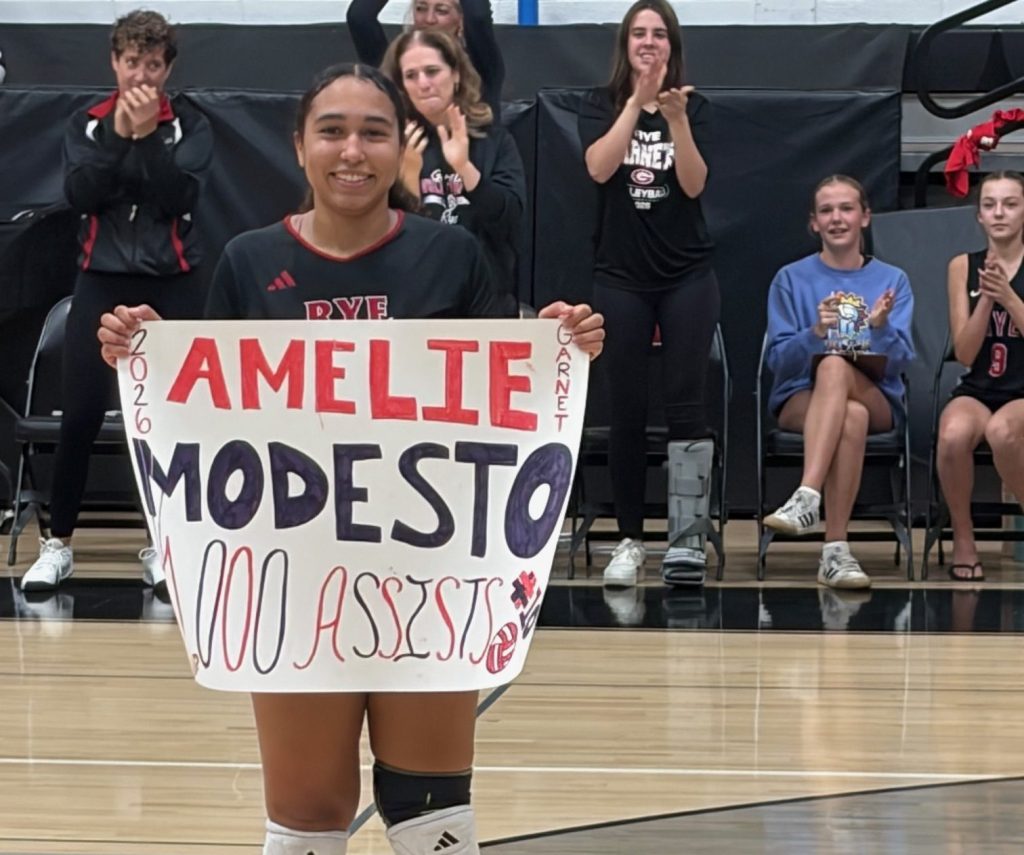 (PHOTO: Rye Volleyball senior Amelie Modesto after her 1000th varsity assist in October 2026. Contributed.)
