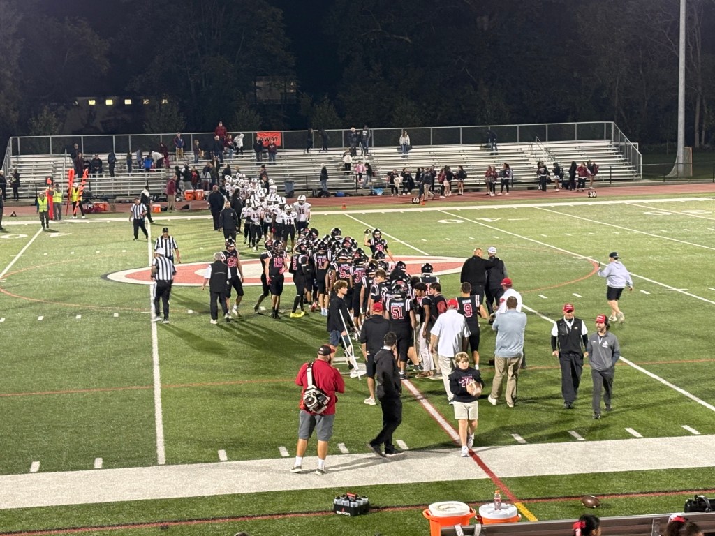 (PHOTO: The Rye Football team in a handshake line after their win on October 9, 2026. Contributed.)