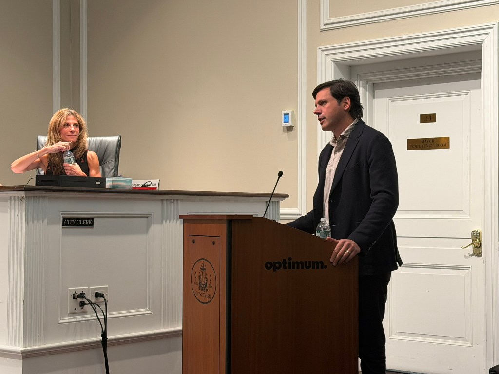 Person speaking at lectern