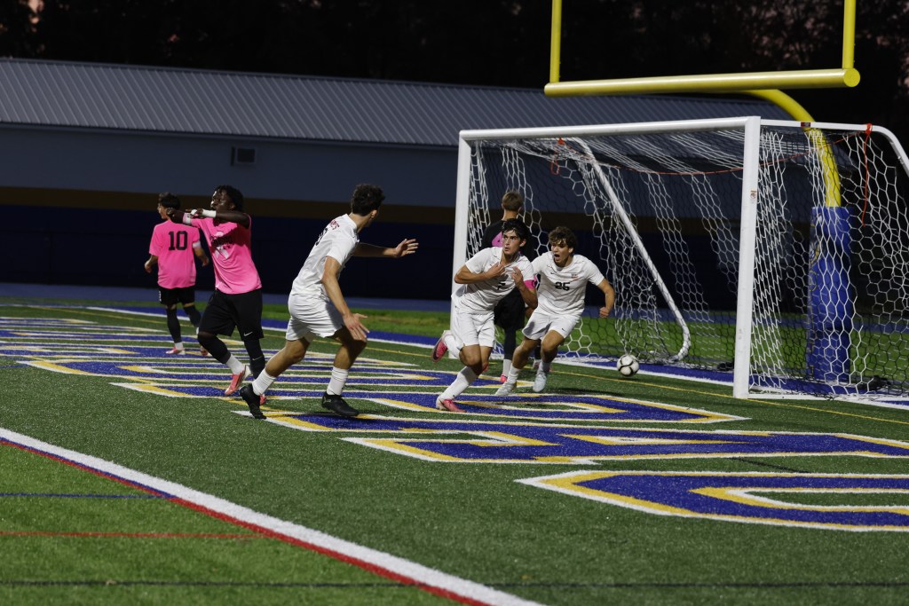 (PHOTO: Rye Boys Soccer's Kasen Scarperi scoring a game-tying goal against Mahopac on October 14, 2026. Credit: Alvar Lee.)