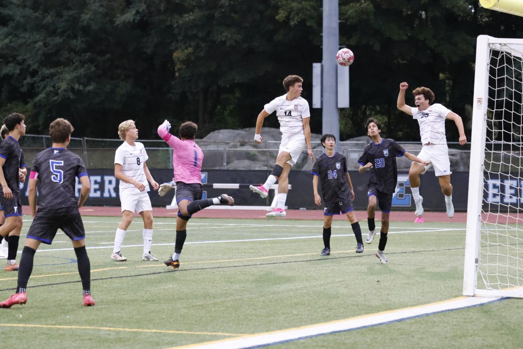 (PHOTO: Rye Boys Soccer's Felix Wismer (#14) going up for a header on October 2, 2026. Credit: Alvar Lee.)