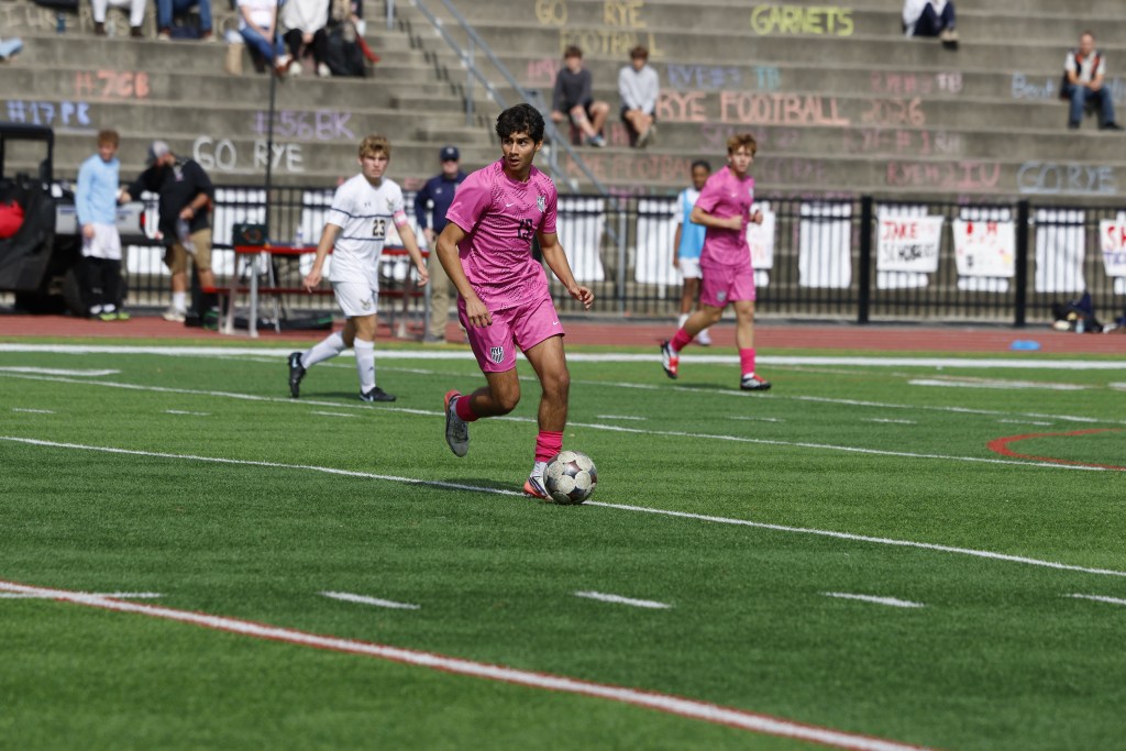(PHOTO: Rye Boys Soccer's Luka Rezende (#13) from a win over Pelham on October 10, 2026. Credit: Alvar Lee.)